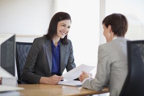 A woman conducts a job interview