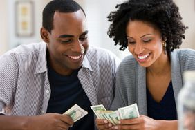 Man and woman counting cash