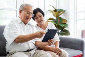 Senior Couple Looking at Tablet Device