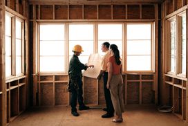 Homebuyers consulting with a contractor