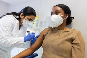 Doctor vaccinating a woman