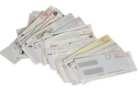 a stack of opened business envelopes