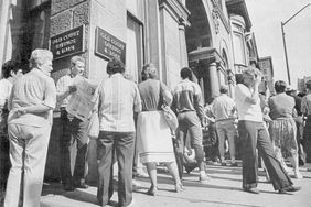Depositors form a line to make withdrawals from a troubled S&L bank in Baltimore.