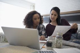 Teenager working on a budget with mother's help