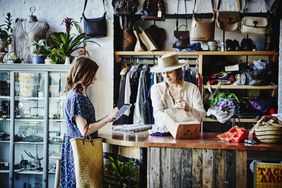 Woman shopping at a small business boutique clothing store.