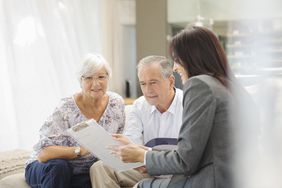 Retirement planner going over financial goals with an older couple