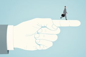 graphic of business man walking on top of a pointing hand giving him direction