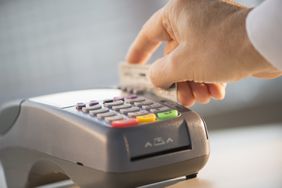 Person using a credit card or debit card
