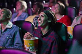 Moviegoers Enjoying Popcorn