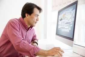 man investing in stocks on computer