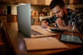 Man reviewing finances at home