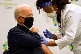 president biden getting a covid-19 vaccination from a doctor