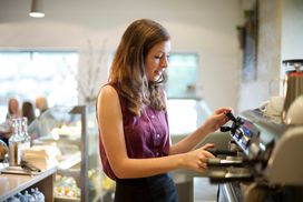 Young woman working at coffee shop
