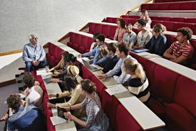 Students listening to teacher in class