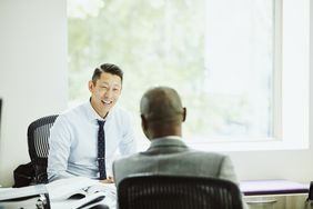 Smiling businessman in discussion