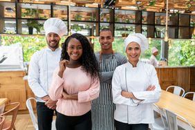 Business owner with her staff working at a restaurant