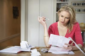 Woman reviewing bills