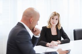 Businessman and businesswoman in conference room
