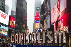 capitalism sign in Time's Square NYC