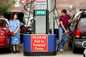 Costco customers putting gas in their vehicles