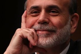 Federal Reserve Board Chairman Ben Bernanke rests face in hand