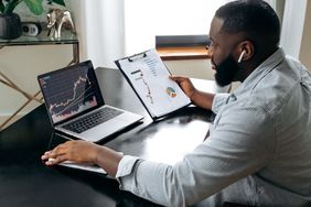 Investor checking prices on a home computer