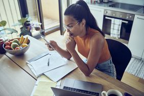 Woman managing finances at home