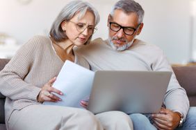 Couple paying bills online