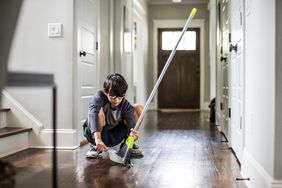 Boy Sweeping Floor