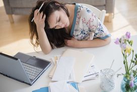 Stressed woman paying credit card bills
