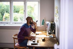 Man using computer in home office