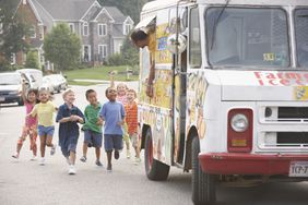 Children running toward an ice cream truck