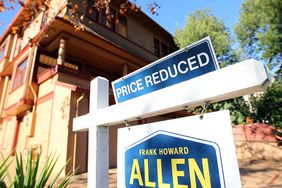 home with priced reduced sign outside