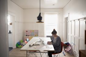 freelance designer working from home studio that also doubles as child playroom