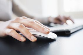 Hand with computer mouse.