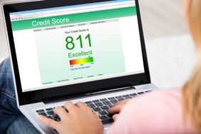 Woman checking her credit score online from her laptop