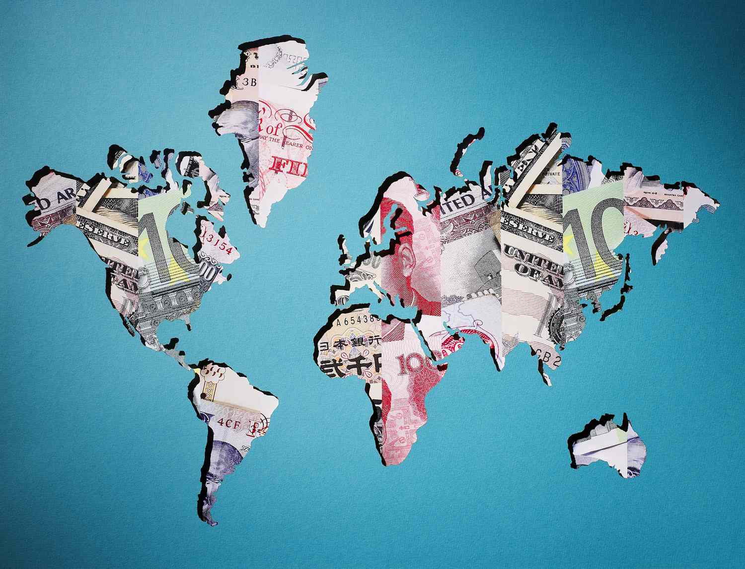 Map of world made of various currency
