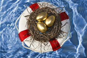 Golden eggs in a nest floating in a lifesaver, representing protecting your savings and investments.