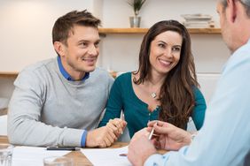 a couple meeting with a financial person