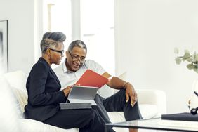 Man meeting with financial advisor at home about retirement planning