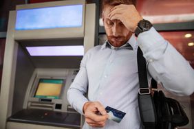 Stressful businessman doesn't have enough money on his credit ca