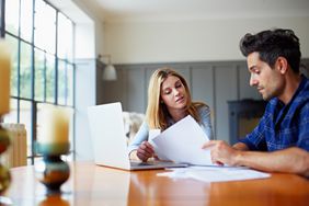 Couple reviewing investment paperwork
