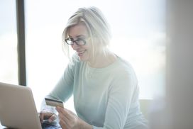 Woman happy because she has established enough credit history for a credit card.