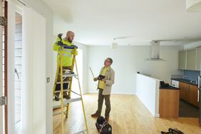 Landlord and contractor making repairs to a rental property