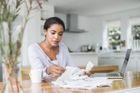 Woman preparing tax return online at home