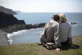 Senior couple looking out to sea