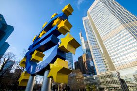 Euro sign sculpture in front of European Central Bank building in Frankfurt