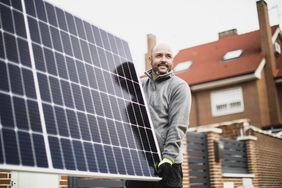 Person installing solar panels